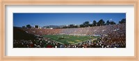 Framed High angle view of spectators watching a football match in a stadium, Rose Bowl Stadium, Pasadena, California