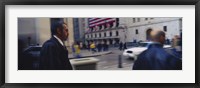 Framed Two people walking, New York Stock Exchange, Wall Street, Times Square, Manhattan, New York City, New York State, USA