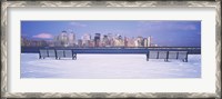 Framed Park benches in snow with a city in the background, Lower Manhattan, Manhattan, New York City, New York State, USA