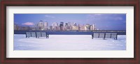 Framed Park benches in snow with a city in the background, Lower Manhattan, Manhattan, New York City, New York State, USA