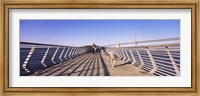 Framed Couple walking on a pier, Bay Bridge, San Francisco, California, USA