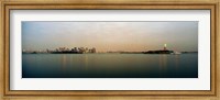 Framed River with the city skyline and Statue of Liberty in the background, New York Harbor, New York City, New York State, USA