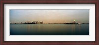 Framed River with the city skyline and Statue of Liberty in the background, New York Harbor, New York City, New York State, USA