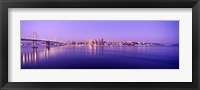 Framed Bay Bridge with a lit up city skyline in the background, San Francisco, California, USA