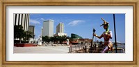 Framed Jester statue with buildings in the background, Riverwalk Area, New Orleans, Louisiana, USA