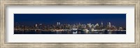 Framed Buildings in a city lit up at dusk, Hudson River, Midtown Manhattan, Manhattan, New York City, New York State, USA