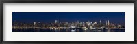 Framed Buildings in a city lit up at dusk, Hudson River, Midtown Manhattan, Manhattan, New York City, New York State, USA