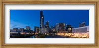 Framed Buildings in a city lit up at dusk, Chicago, Illinois, USA