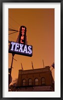 Framed Low angle view of a neon sign of a hotel lit up at dusk, Fort Worth Stockyards, Fort Worth, Texas, USA