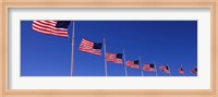 Framed Low angle view of American flags, Washington Monument, Washington DC, USA