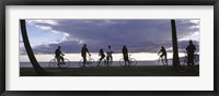 Framed Tourists cycling on the beach, Honolulu, Oahu, Hawaii, USA