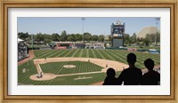 Framed Spectator watching a baseball match at stadium, Raley Field, West Sacramento, Yolo County, California, USA