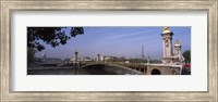 Framed Bridge across a river with the Eiffel Tower in the background, Pont Alexandre III, Seine River, Paris, Ile-de-France, France