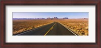 Framed Road passing through a desert, Monument Valley, Arizona, USA