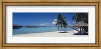 Framed Lounge chair under a beach umbrella, Moana Beach, Bora Bora, French Polynesia