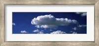 Framed Fluffy clouds in blue sky