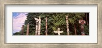 Framed Totem poles in a park, Stanley Park, Vancouver, British Columbia, Canada