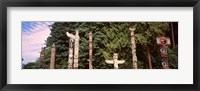 Framed Totem poles in a park, Stanley Park, Vancouver, British Columbia, Canada