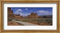 Framed Empty road running through a national park, Arches National Park, Utah, USA
