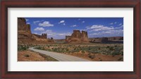 Framed Empty road running through a national park, Arches National Park, Utah, USA