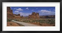 Framed Empty road running through a national park, Arches National Park, Utah, USA