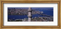 Framed Mid section view of a minaret with bridge across the bosphorus in the background, Istanbul, Turkey