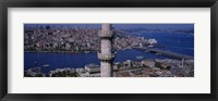 Framed Mid section view of a minaret with bridge across the bosphorus in the background, Istanbul, Turkey