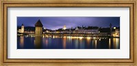 Framed Buildings lit up at dusk, Chapel Bridge, Reuss River, Lucerne, Switzerland