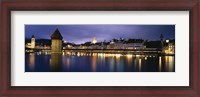 Framed Buildings lit up at dusk, Chapel Bridge, Reuss River, Lucerne, Switzerland