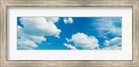 Framed Clouds against a pale blue sky