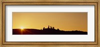 Framed Silhouette of a town on a hill at sunset, San Gimignano, Tuscany, Italy