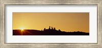 Framed Silhouette of a town on a hill at sunset, San Gimignano, Tuscany, Italy