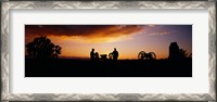 Framed Silhouette of statues of soldiers and cannons in a field, Gettysburg National Military Park, Pennsylvania, USA