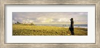Framed USA, California, Businessman standing holding binoculars and looking at the lighthouse