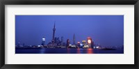 Framed Buildings at the waterfront lit up at dusk, Pudong, Shanghai, China