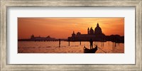 Framed Silhouette of a person on a gondola with a church in background, Santa Maria Della Salute, Grand Canal, Venice, Italy