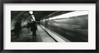 Framed Subway train passing through a subway station, London, England