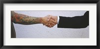 Framed Close-Up Of Two Men Shaking Hands, Germany