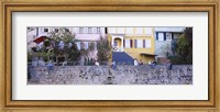 Framed Low Angle View Of A Group Of People Sitting On A Wall, Tubingen, Baden-Wurttemberg, Germany