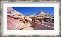 Framed Two people cycling on the road, Zion National Park, Utah, USA