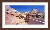 Framed Two people cycling on the road, Zion National Park, Utah, USA