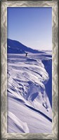 Framed Person walking on a snow covered mountain, Snaefellsnes Peninsula, Iceland
