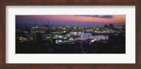 Framed High angle view of city at a port lit up at dusk, Genoa, Liguria, Italy