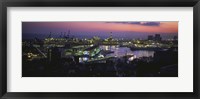 Framed High angle view of city at a port lit up at dusk, Genoa, Liguria, Italy