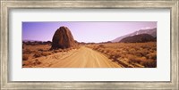 Framed Dirt road passing through an arid landscape, Californian Sierra Nevada, California, USA