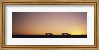Framed Silhouette of two trucks moving on a highway, Interstate 5, California, USA
