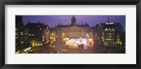 Framed High angle view of a town square lit up at dusk, Dam Square, Amsterdam, Netherlands