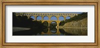 Framed Reflection of an arch bridge in a river, Pont Du Gard, France