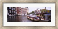 Framed Tourboat in a channel, Amsterdam, Netherlands