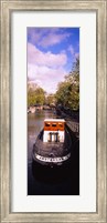 Framed Tourboat docked in a channel, Amsterdam, Netherlands